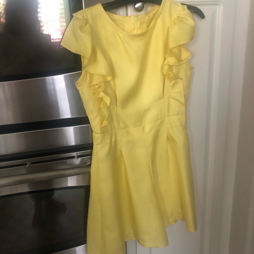 yellow romper with ruffles